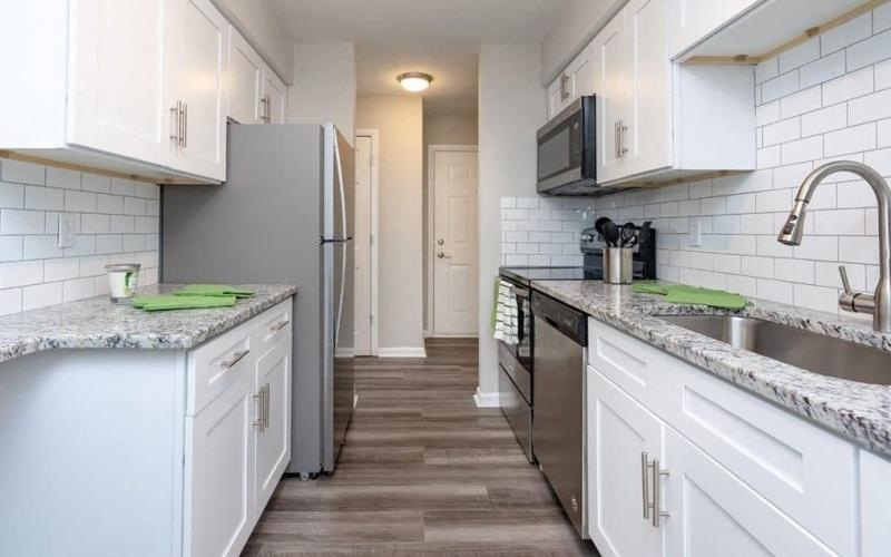 galley kitchen with ample lighting