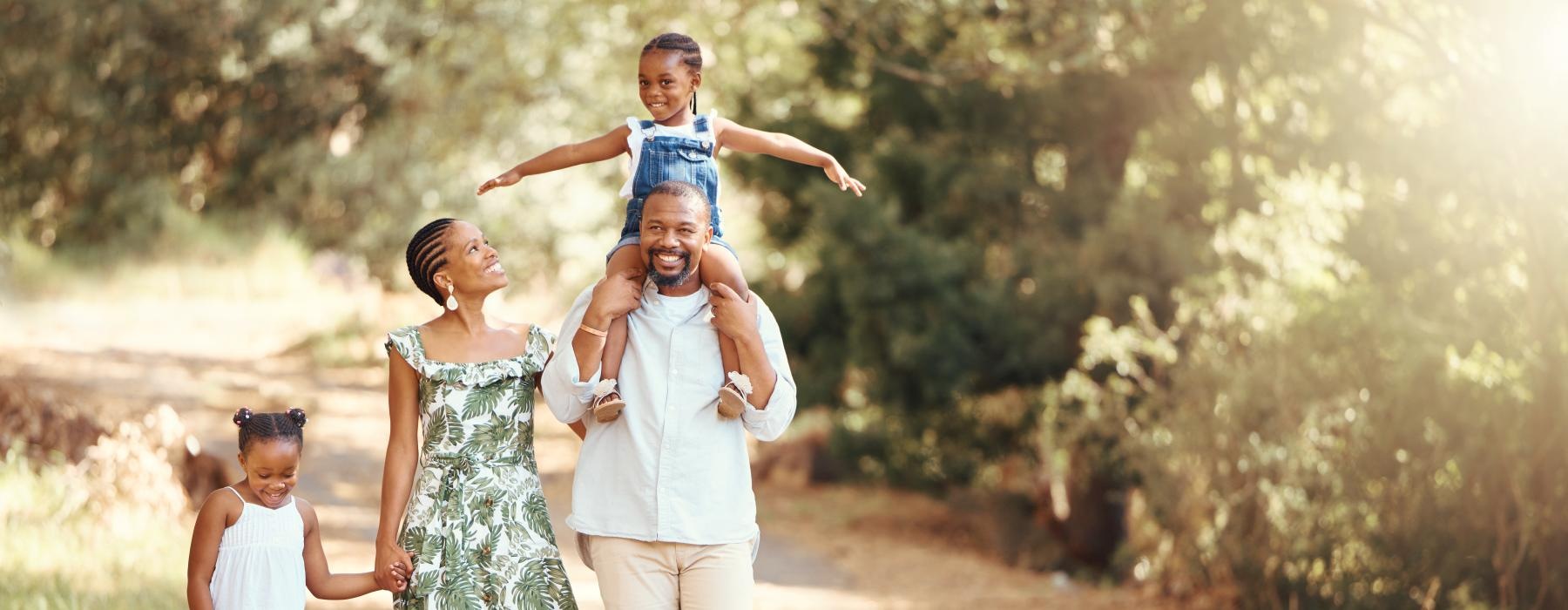 a family walking on a dirt road